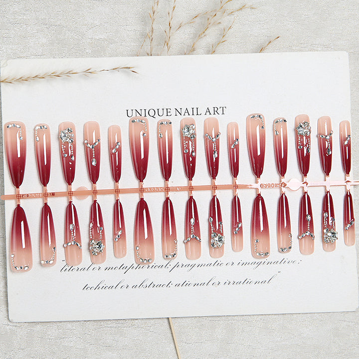 Artificial nails with elegant glitter and jewelry accents Kalsten