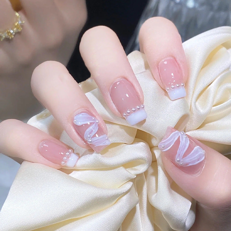 Elegant artificial nail set with stylish wave pattern and pearl accents Kalsten