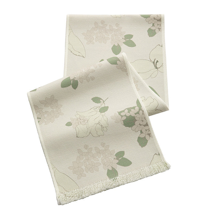 Woven table runner with floral jacquard pattern and fringed edge Kalsten