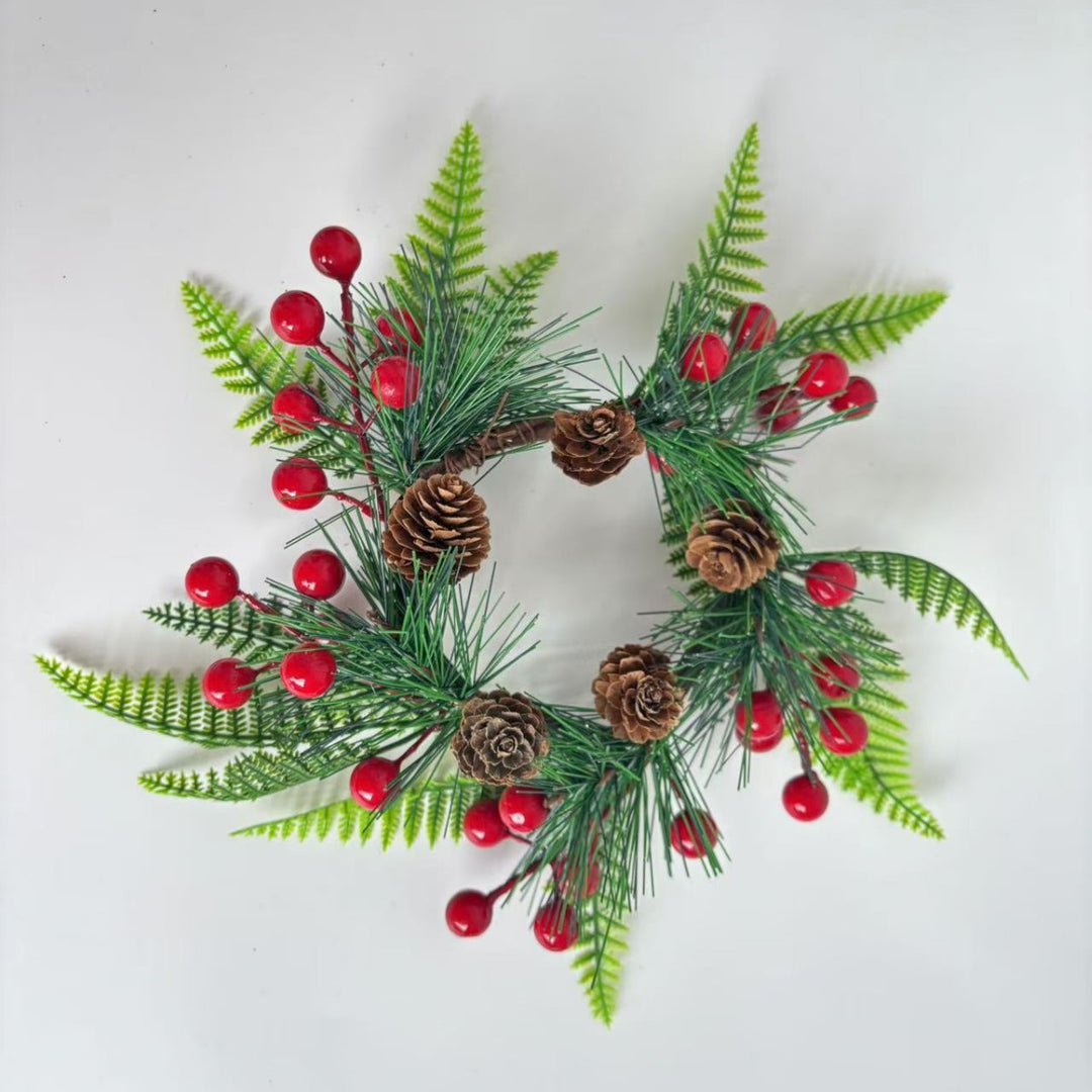 Christmas wreath with pine cones and red berries