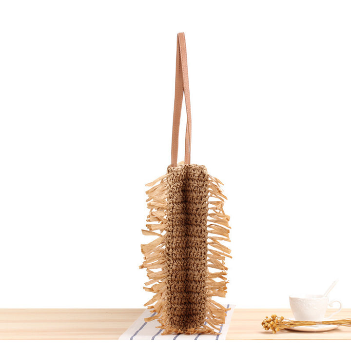 Beach bag with fringed design made of natural woven material Kalsten