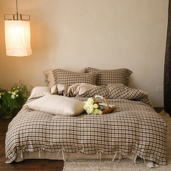 Checked cotton bedding set with decorative ribbons, ruffles, and subtly embroidered detail