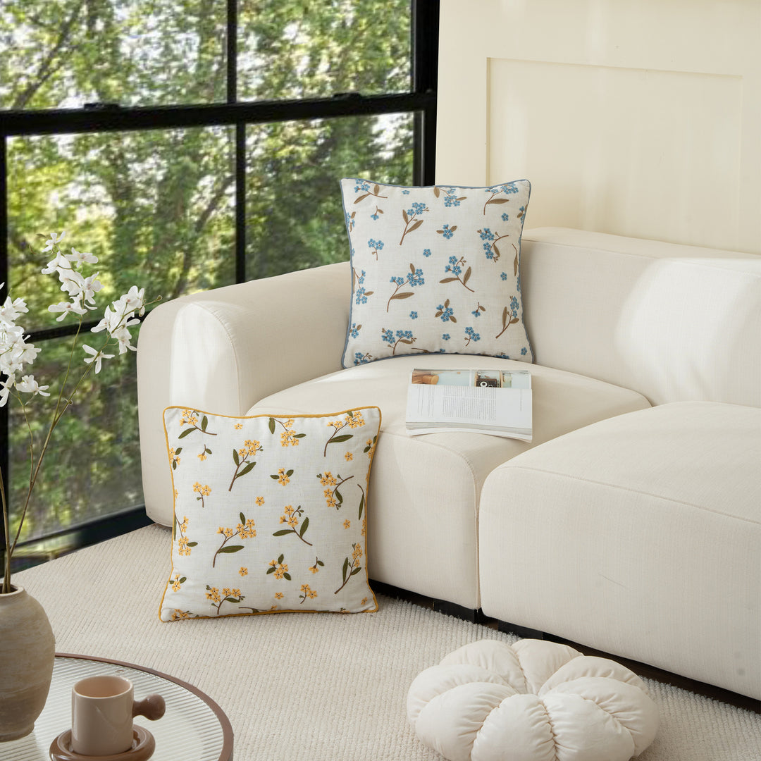 Decorative embroidered cushion cover made of linen blend with floral yellow flower appliqué and piping Kalsten