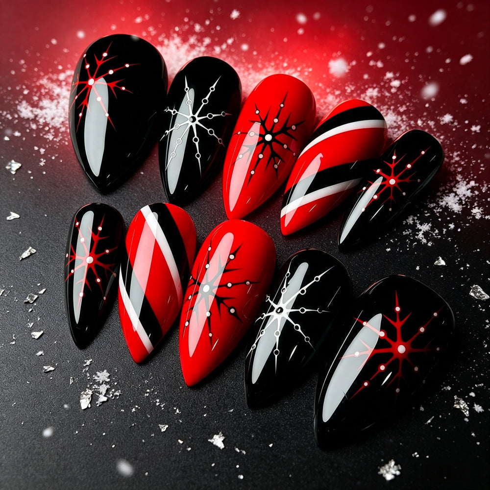 Artificial nails in modern stiletto design with graphic accents Kalsten