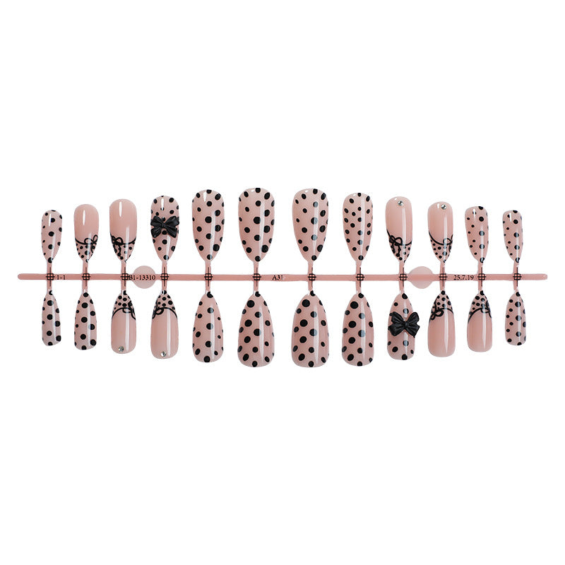 Creative nail art set with elegant dots and bow decorations Kalsten