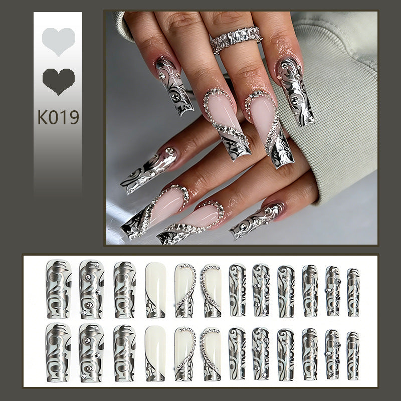 Acrylic nail set with elegant patterns and sparkling accents Kalsten