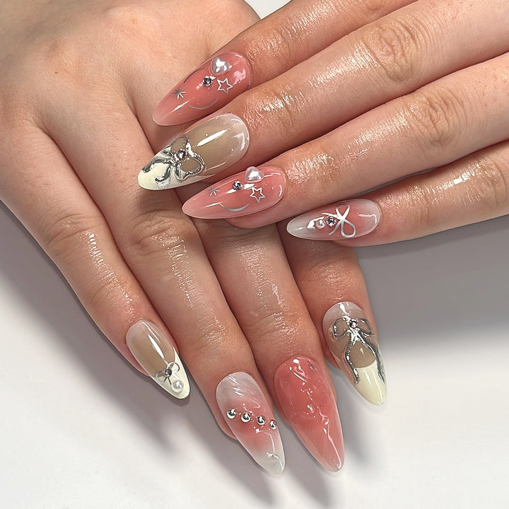 Artistic Nail Tips with Glitter and Bow Motifs Kalsten