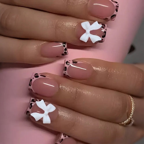 Artificial nail set with impressive floral and bow accents Kalsten
