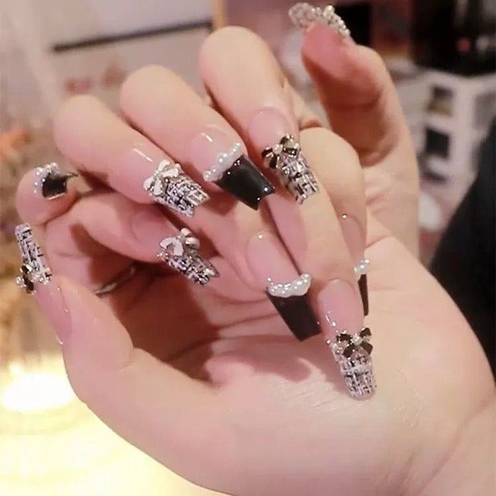 Artistic Nail Art with Glitter and Flower Applications Kalsten