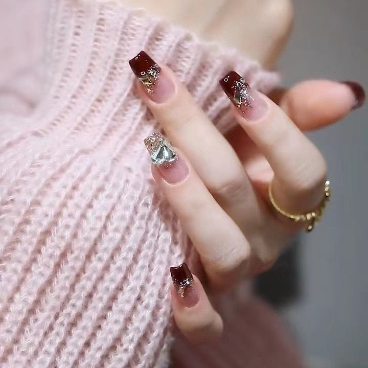 Artificials nails with glitter embellishments and elegant accents Kalsten