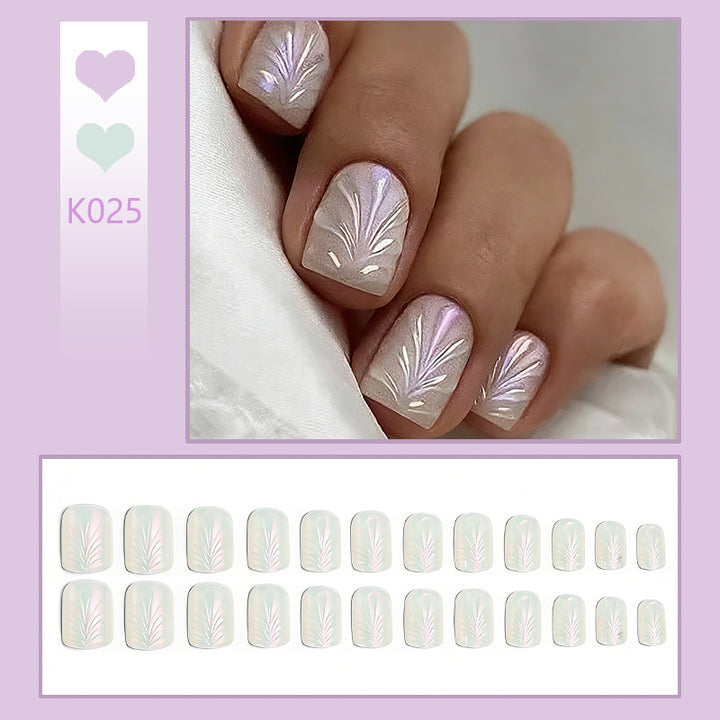 Acrylic nail set with elegant pearl details and fine floral patterns Kalsten