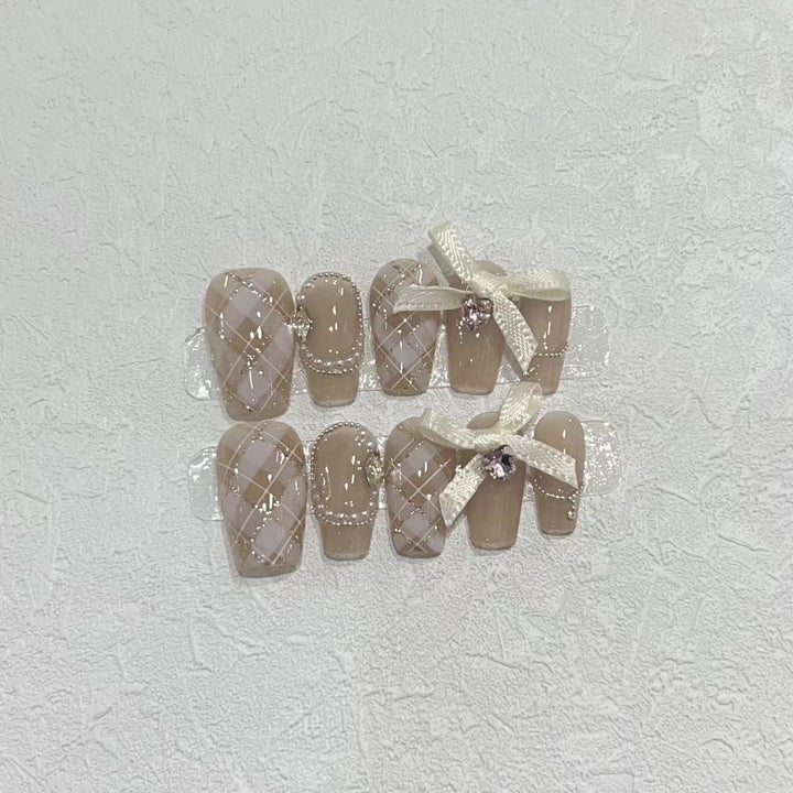 Elegant Press-On Nail Art Set with Ribbons and Gemstone Accents Kalsten