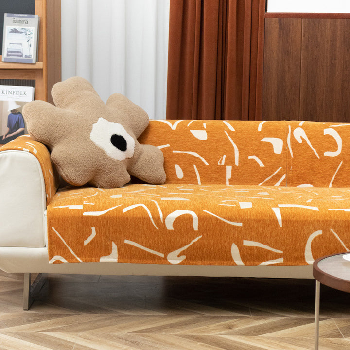 Removable sofa cover with abstract graphic print and elastic fitting edge
