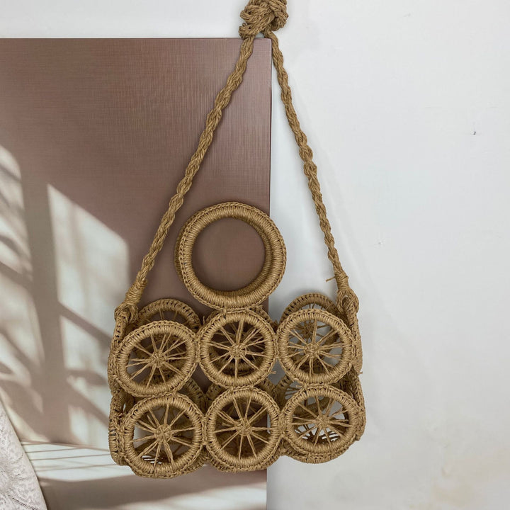 Artisan woven basket bag with striking wheel pattern Kalsten