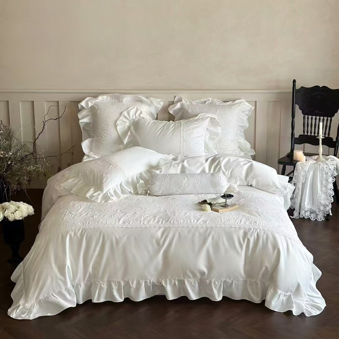 Luxurious satin bedding set with ruffles, lace trim, and fine embroidery