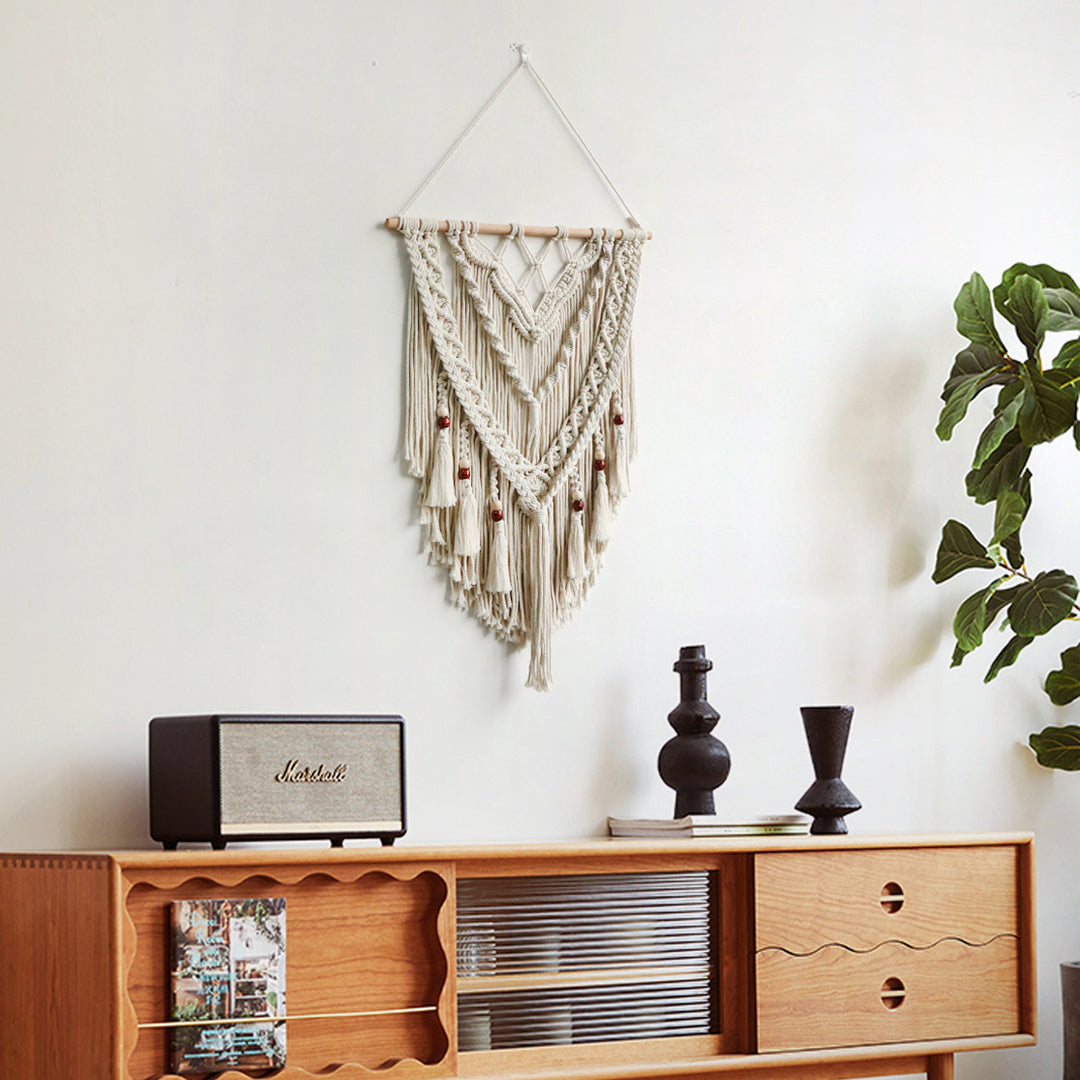 Hand-woven macrame wall hanging with decorative tassels