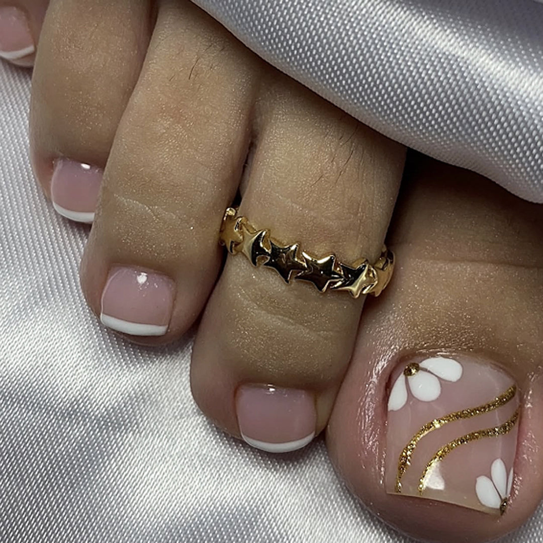 Nail art with elegant blooming designs and glitter accents Kalsten