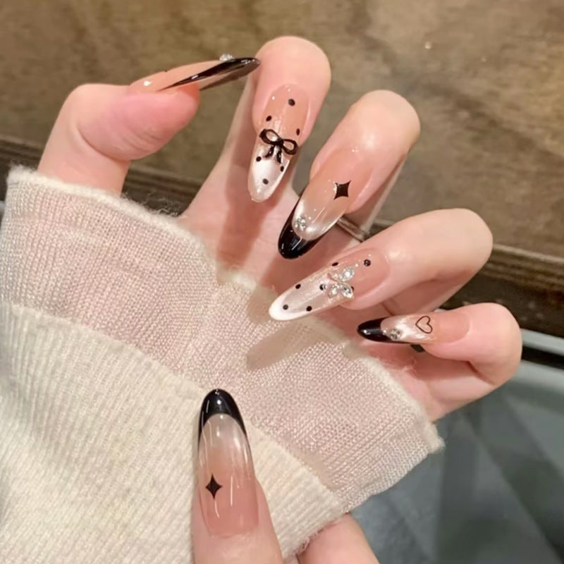 Glamorous artificial nails with creative embellishments Kalsten