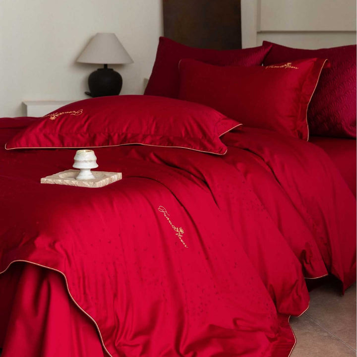 Luxurious satin bedding complete set with quilted cover and delicate logo embroidery