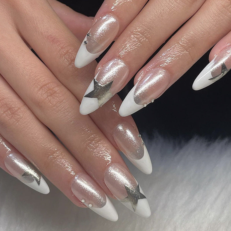 Artful stiletto nails with glitter and star motifs Kalsten