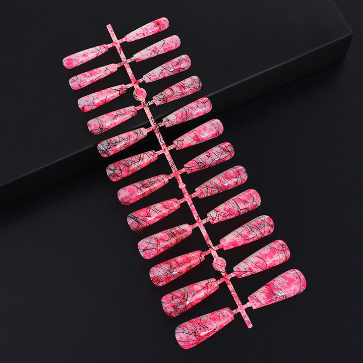 Creative nail art with blood splatter design Kalsten