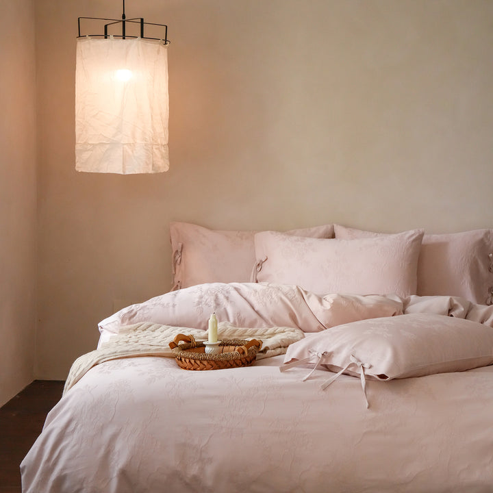 Fine cotton bedding set with jacquard floral pattern and side decorative ribbons