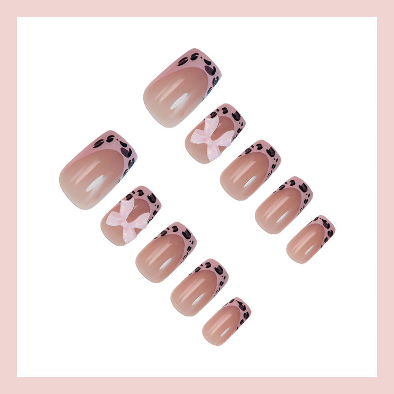 Acrylic nail set with playful bows and modern accents Kalsten