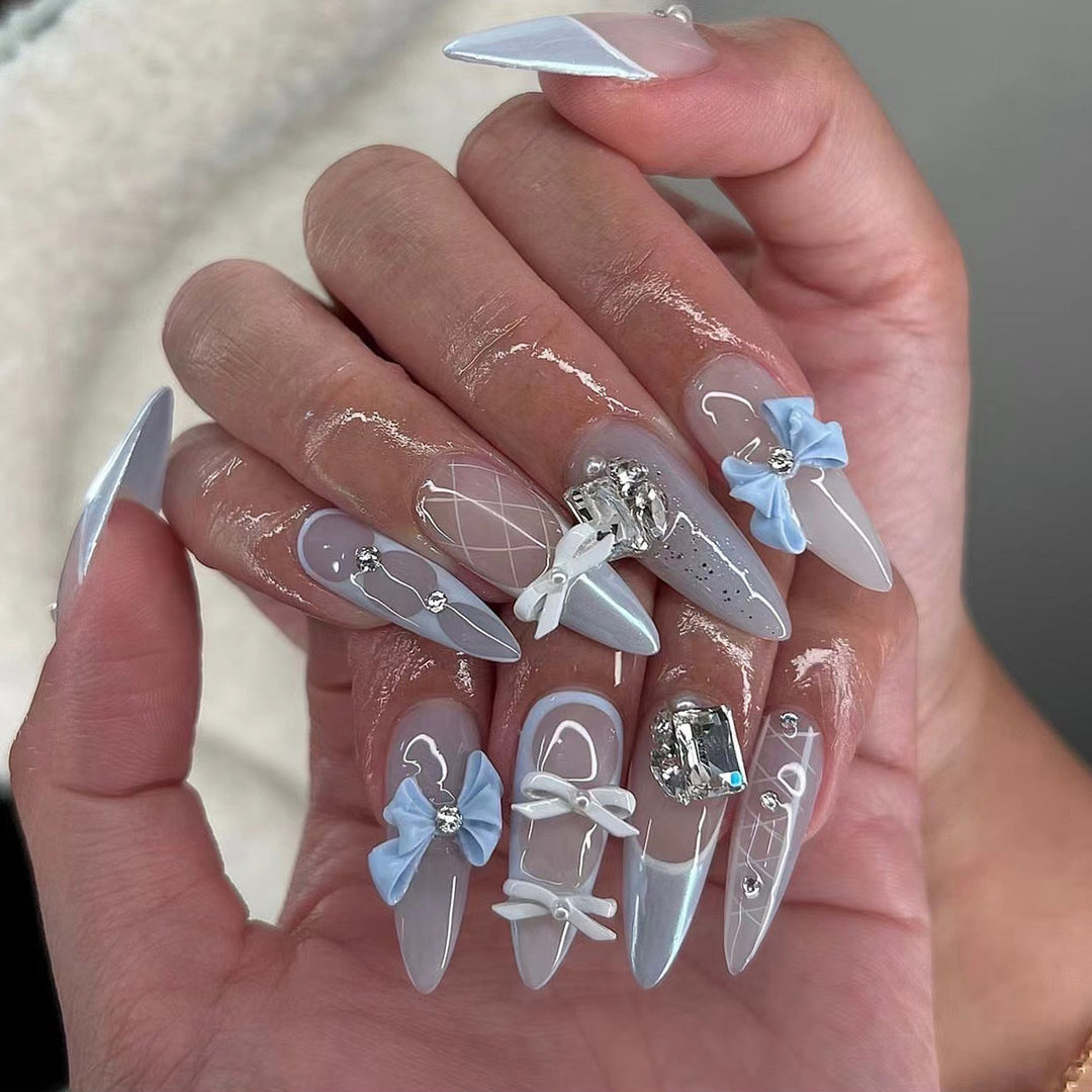 Artistic stiletto nails with elegant jewelry accents Kalsten