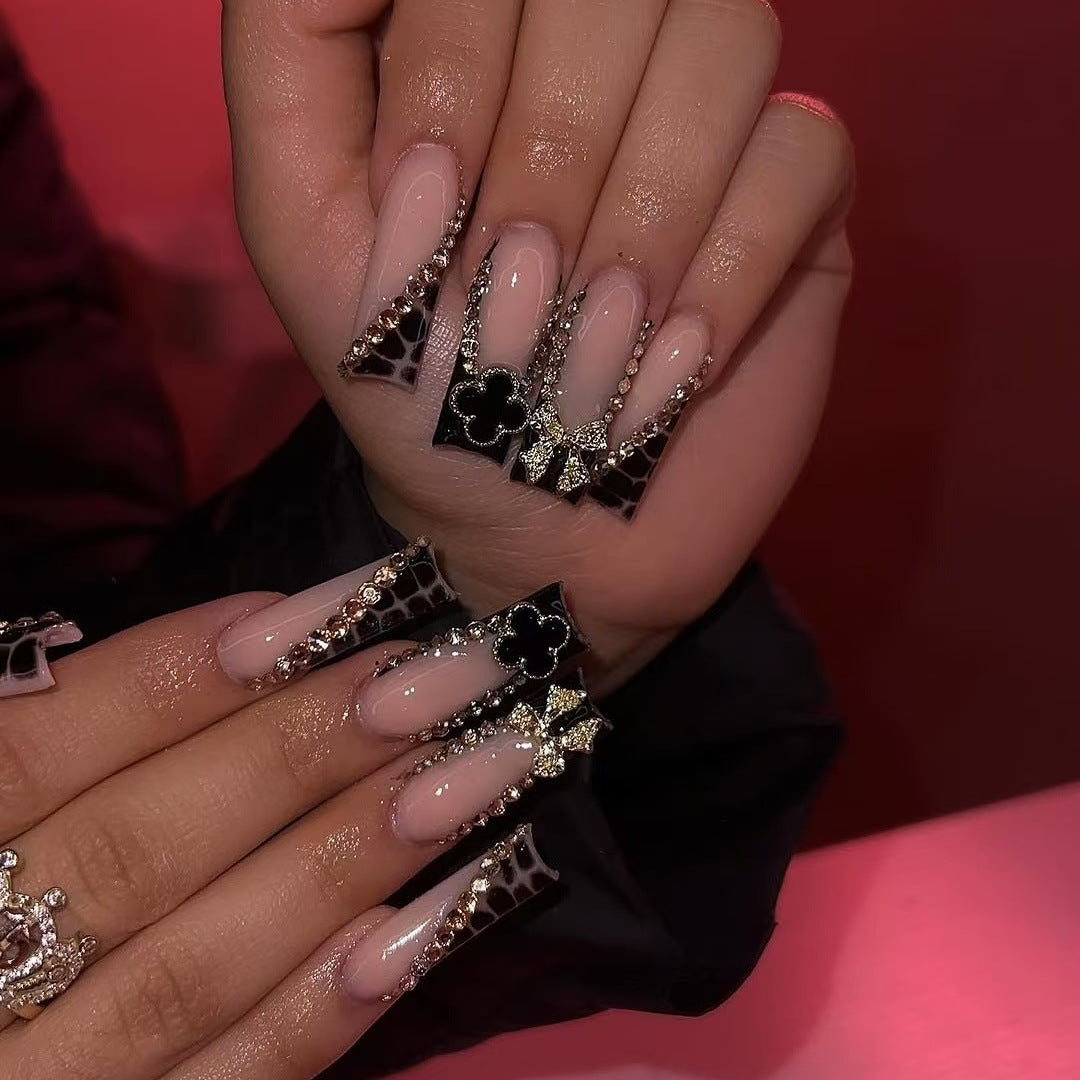 Glamorous artificial nails with elegant design with rhinestones and 3D decorations Kalsten