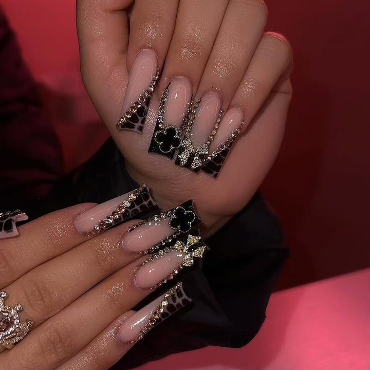 Glamorous artificial nails with elegant design with rhinestones and 3D decorations Kalsten