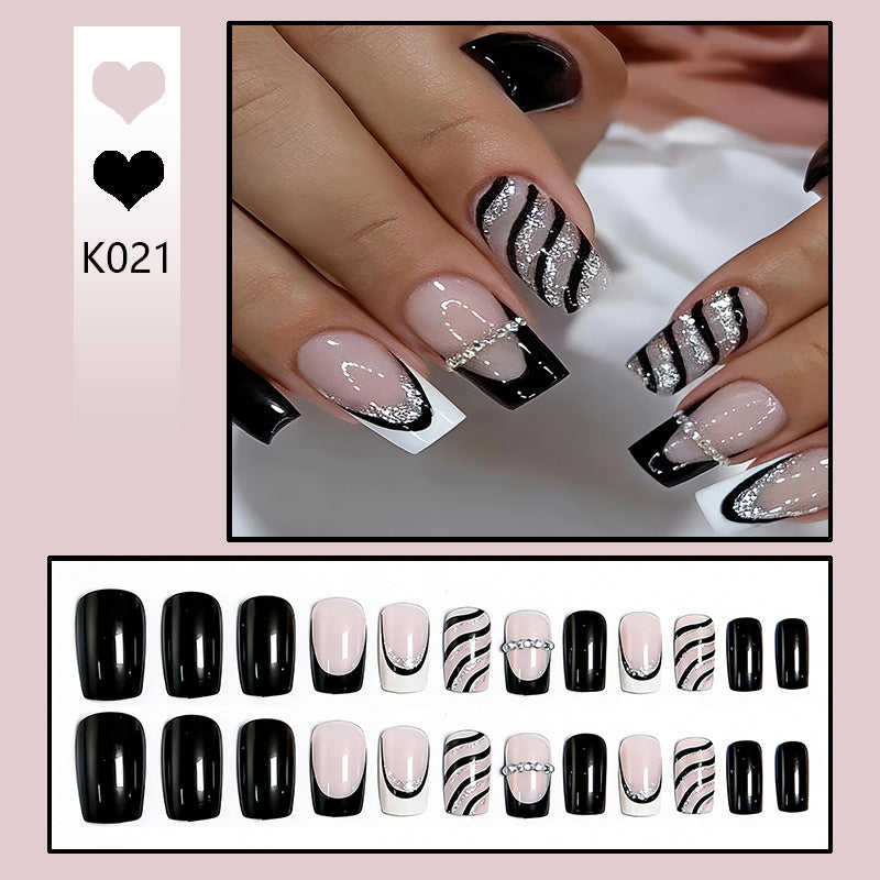 Elegant artificial nails with glitter and stripe accents Kalsten