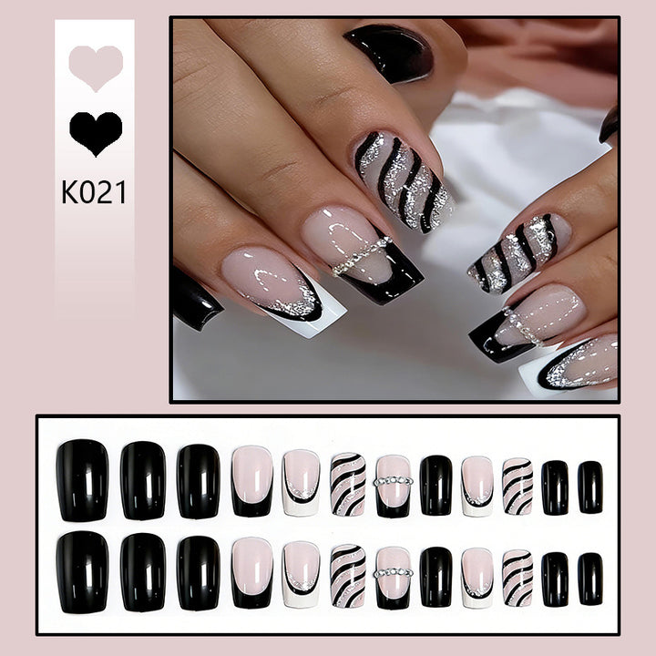 Elegant artificial nails with glitter and stripe accents Kalsten