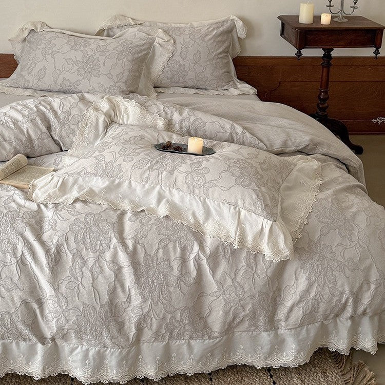 Jacquard bedding set with floral relief pattern and lace border