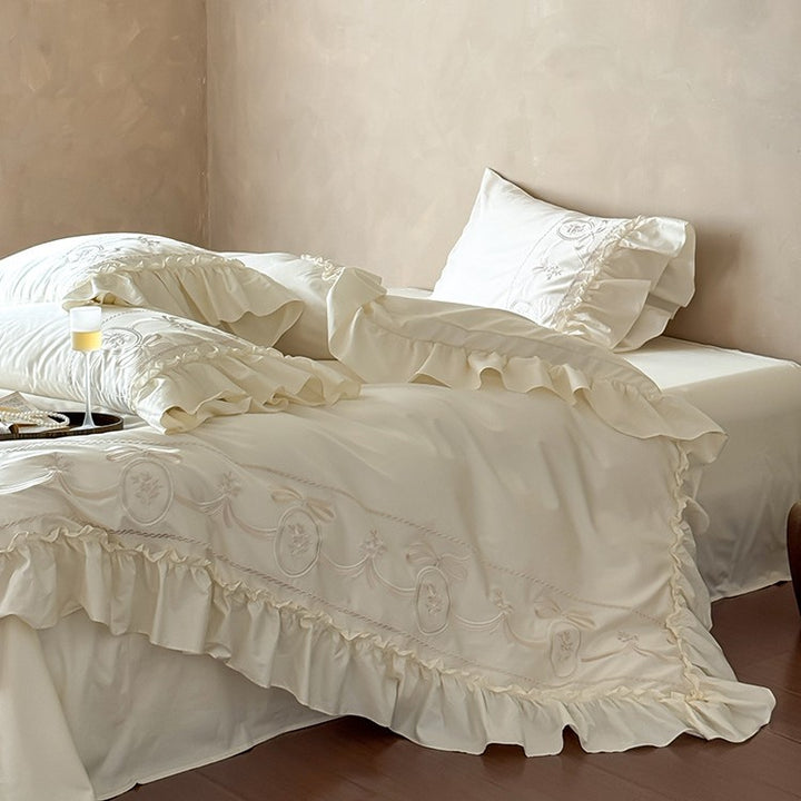 Luxurious satin bedding set with ornamental embroidery and gathered hem