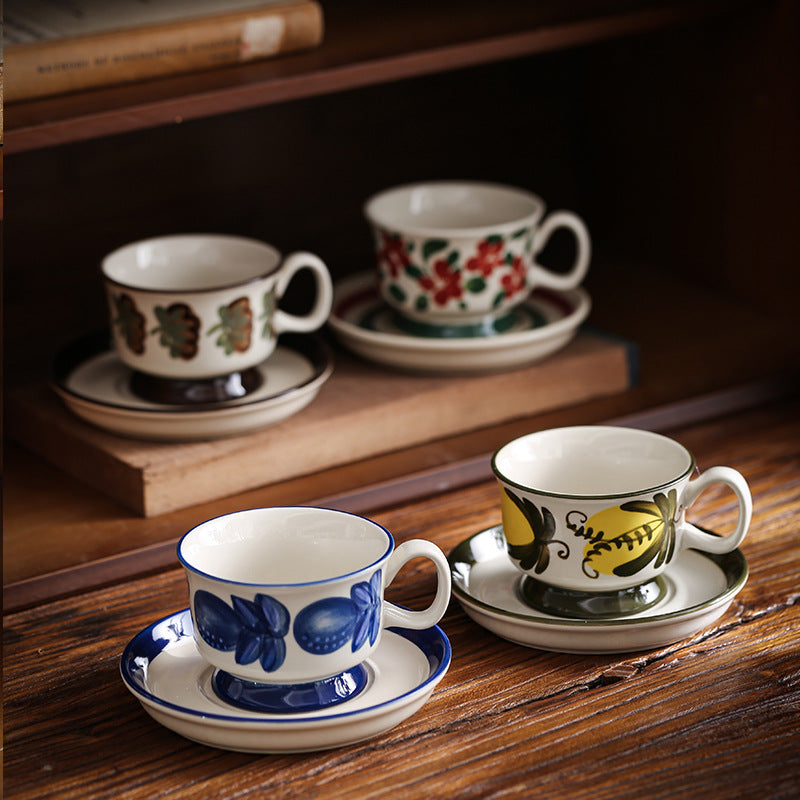 Ceramic coffee cup set with saucer and hand-painted leaf ornament