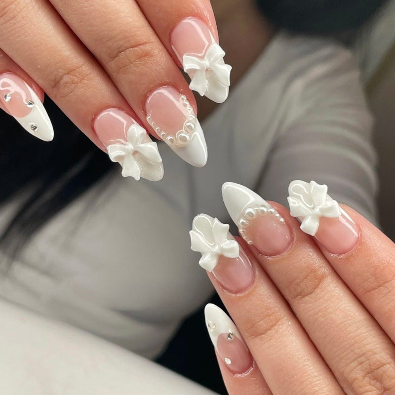 Artful stiletto nails with elegant flower embellishment Kalsten