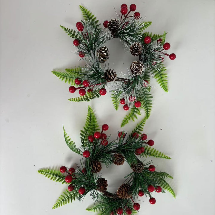 Christmas wreath with pine cones and red berries