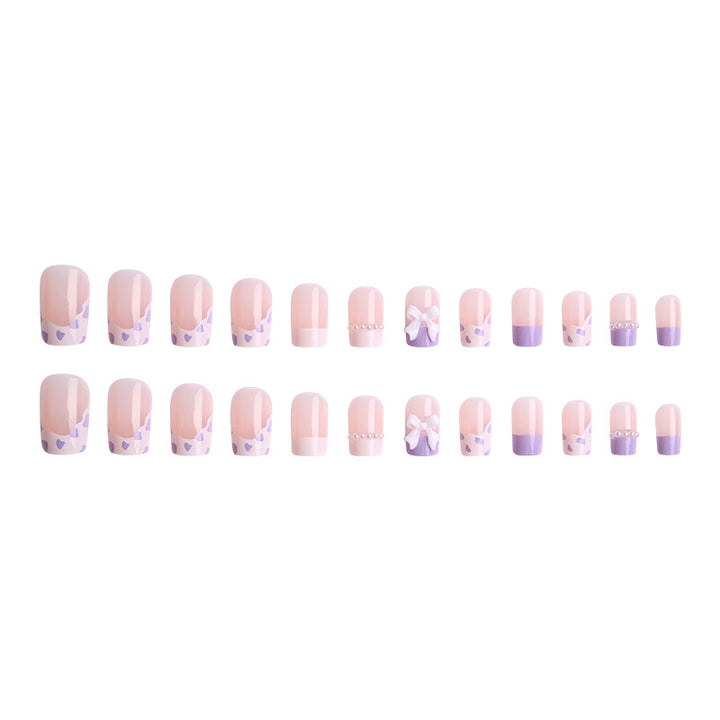 Nail art set with elegant wave patterns and delicate pearl accents Kalsten