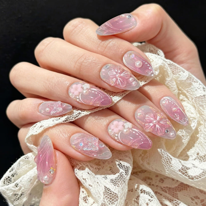Acrylic nail set with elegant flower design and glitter accents Kalsten