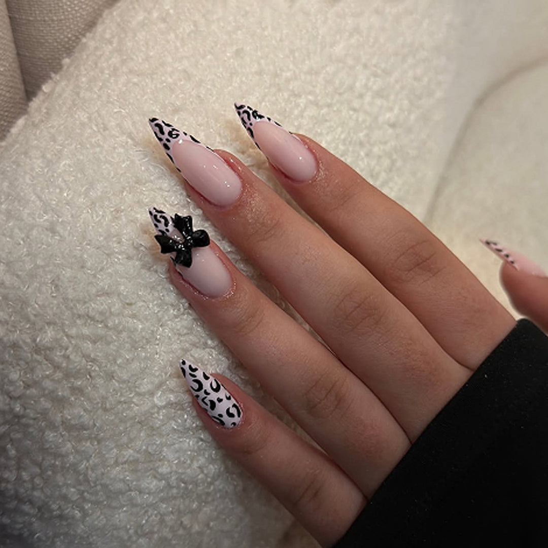 Artful Stiletto Nails with Leopard Print and Bow Accent Kalsten