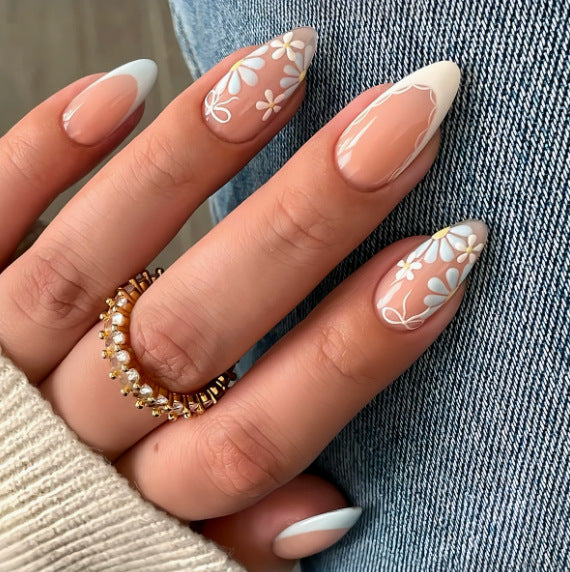 Acrylic nail set with floral accents and elegant tips Kalsten