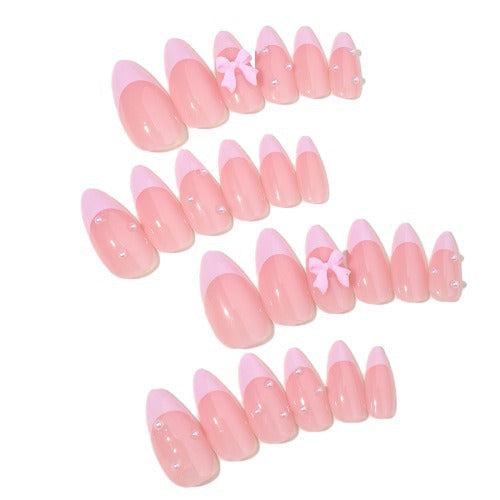 Artificial nail set with delicate bow and glitter accents Kalsten