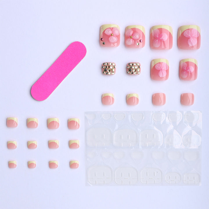 Artificial nail extensions with flower design and glitter accents Kalsten