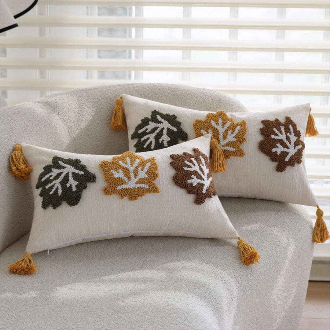 Rectangular decorative cushion cover made of linen look with raised leaf appliqués and corner tassels Kalsten