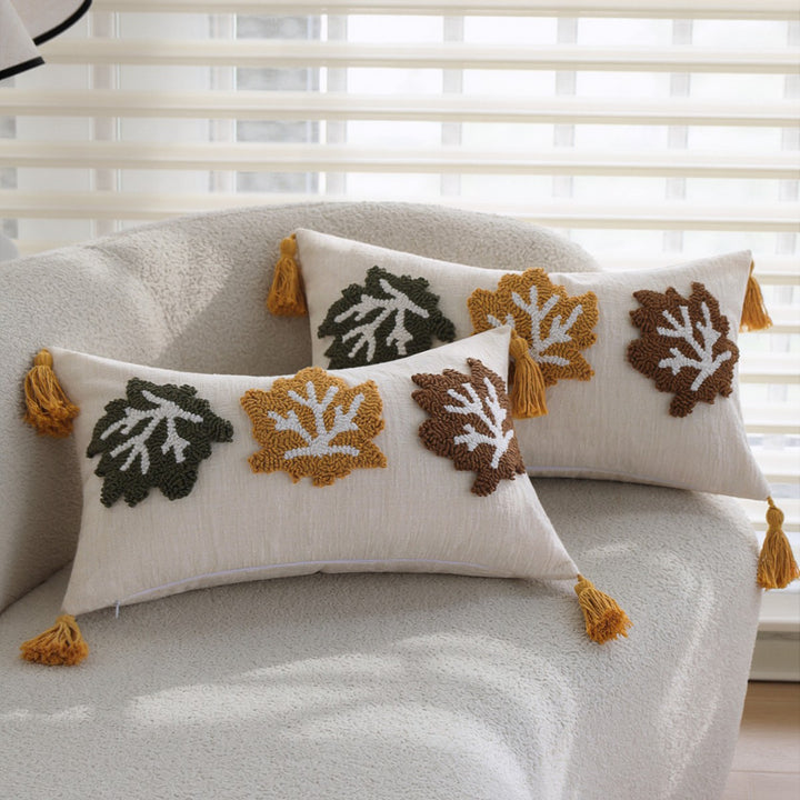 Rectangular decorative cushion cover made of linen look with raised leaf appliqués and corner tassels Kalsten