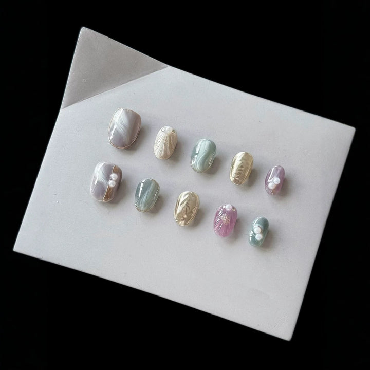 Artistic Press-On Nail Set with Natural Marble Designs