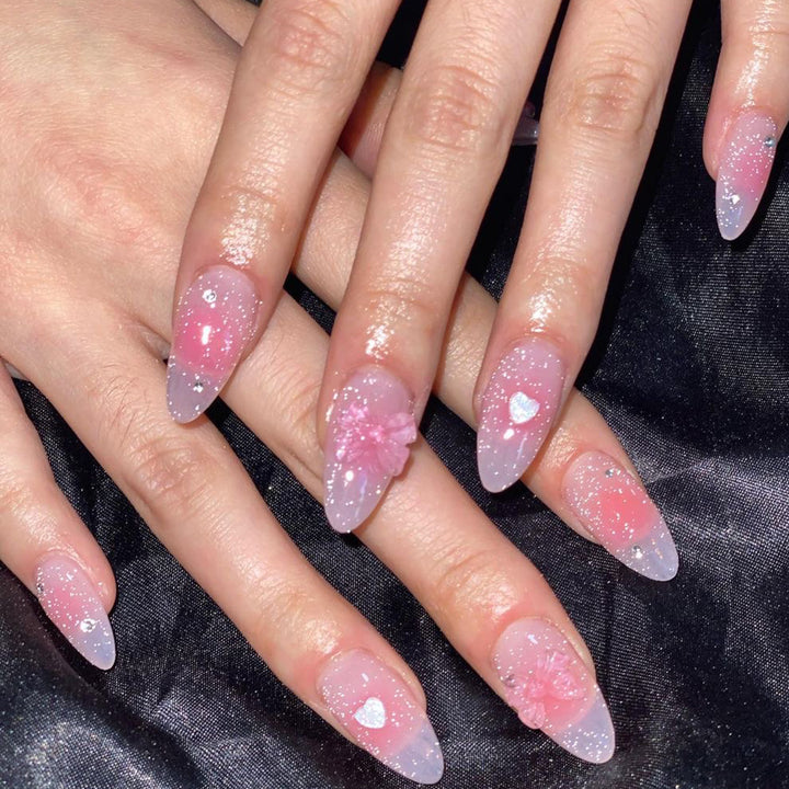 Artistic stiletto nails with floral design and glitter Kalsten