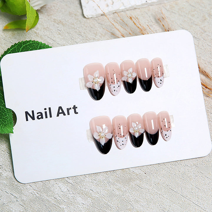 Artful nail tips with floral embellishments Kalsten