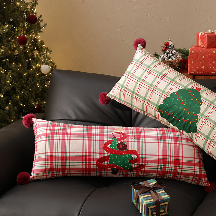 Long decorative lumbar and neck pillow in Christmas check with pompom and dog-tree motif Kalsten