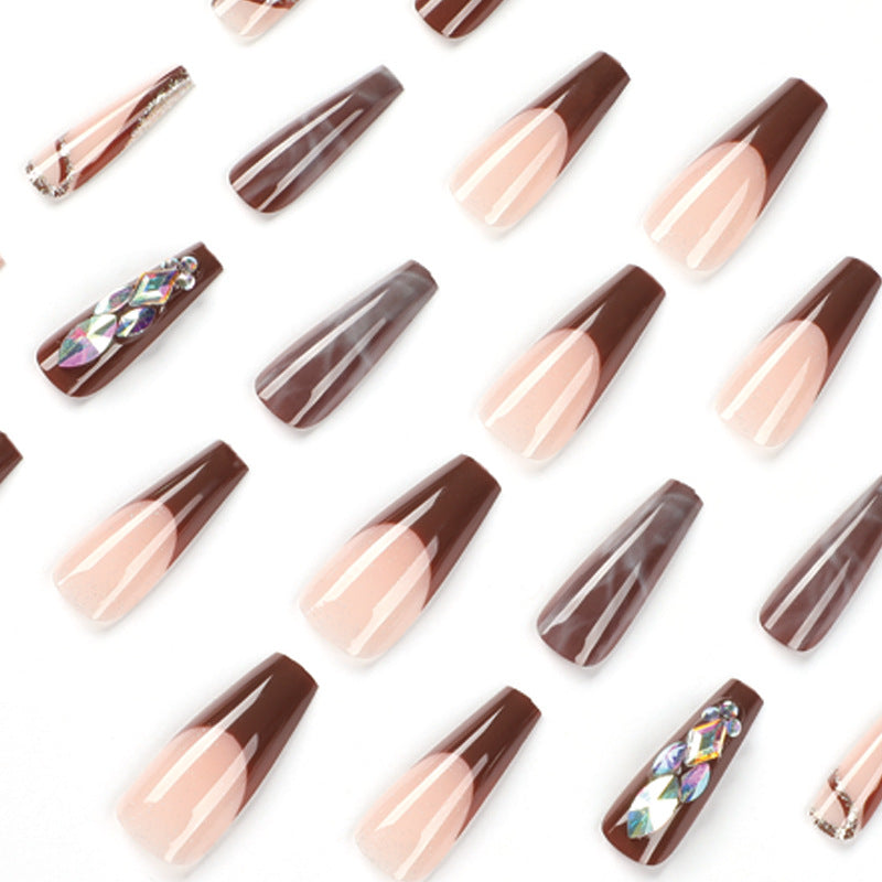 Artificial nail extensions with elegant gemstone embellishments Kalsten
